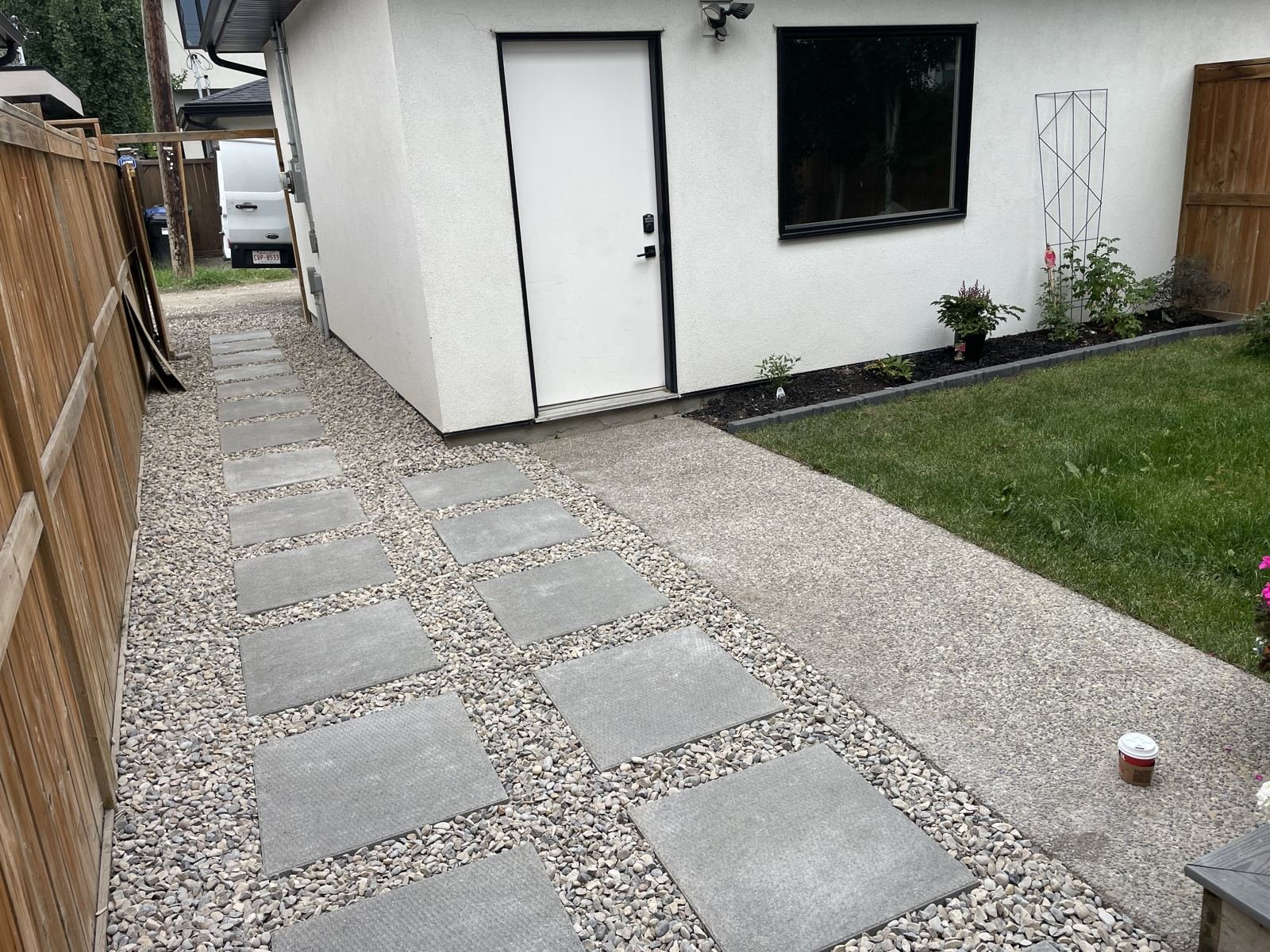 Stepping stone path through side yard gravel